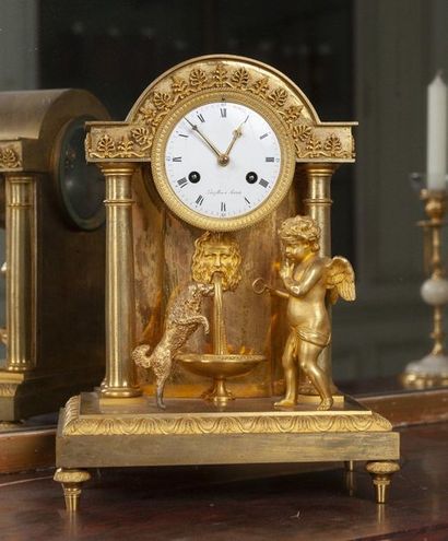 A gilt bronze bound clock representing a...
