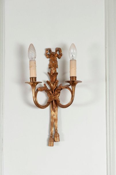 Pair of ormolu sconces with two light arms...