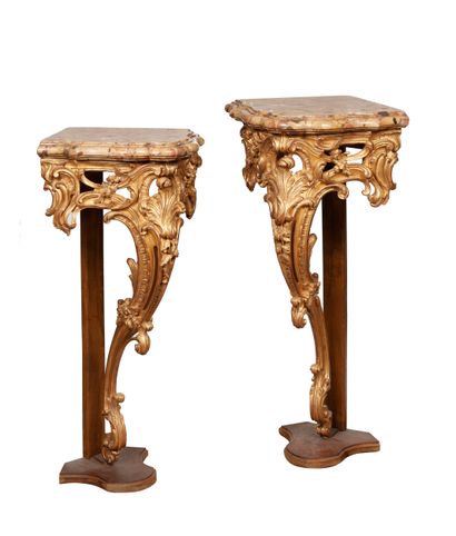
Pair of corner consoles in carved and gilded...