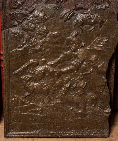 Fragment of a cast iron fireback showing...
