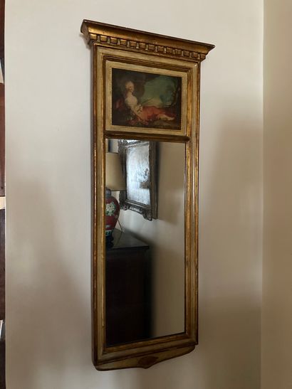 Carved and gilded wood mirror with ribbon...