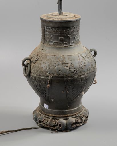 A patinated bronze vase of archaic style...