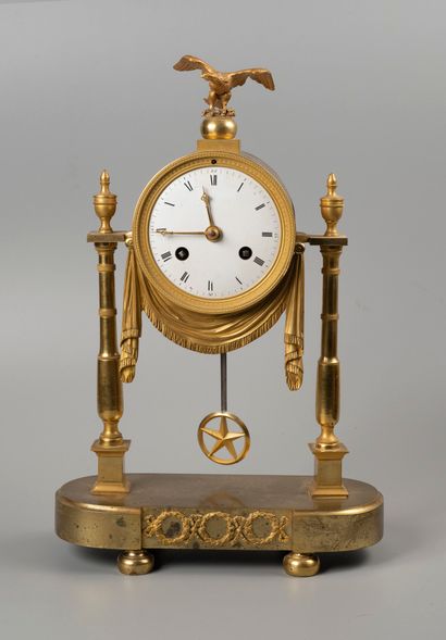 Bronze portico clock, the dial underlined...