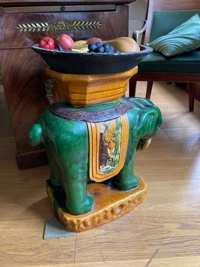Green and yellow glazed earthenware elephant...