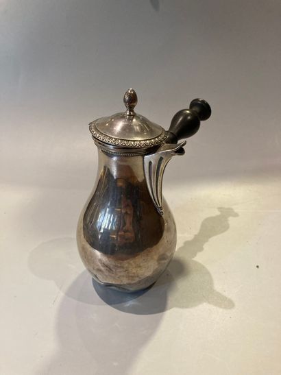 Flat-bottomed silver self-serving jug decorated...