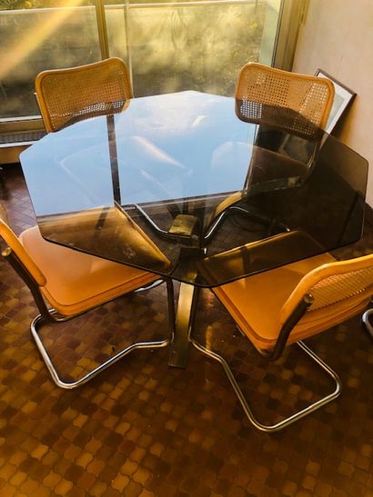 Dining room set including a table with steel...