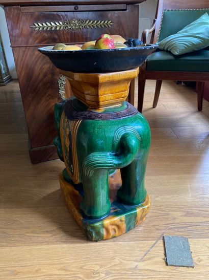 Green and yellow glazed earthenware elephant...