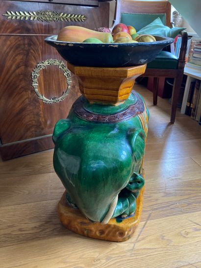 Green and yellow glazed earthenware elephant...