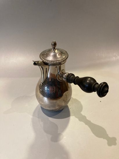 Flat-bottomed silver self-serving jug decorated...