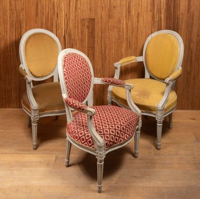 Suite of three carved and painted wood armchairs.

Louis...