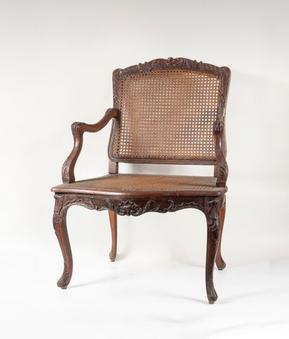 Carved wood armchair, decorated with rocaille,...