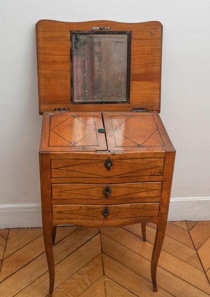 Small dressing table in writing table. The...