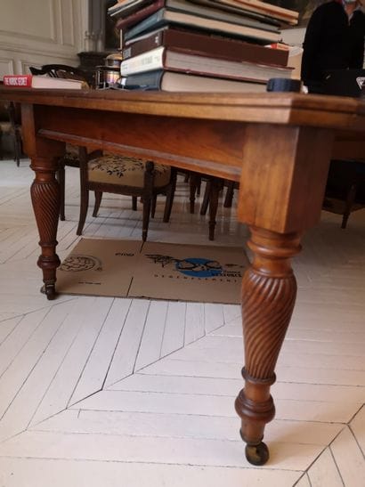 Dining room table partially in mahogany veneer....
