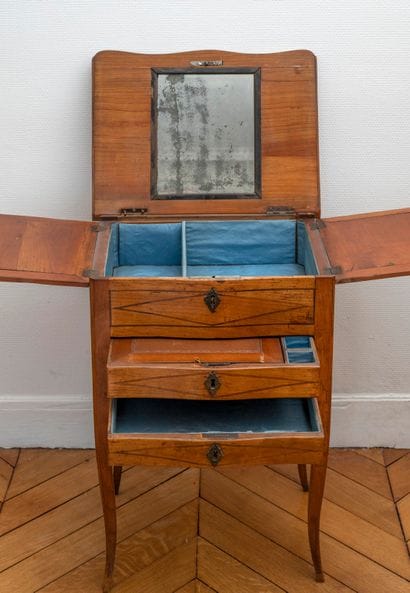 Small dressing table in writing table. The...