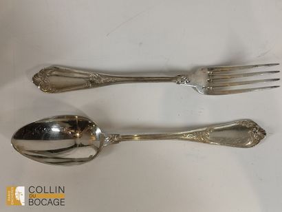 12 plain silver spoons and 12 forks decorated...