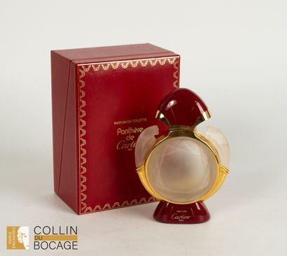 Set of four perfume bottles including Cartier,...
