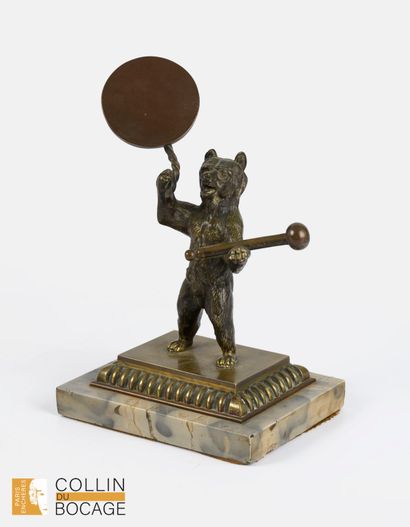 Bear standing on its paws. 
Bronze, resting...