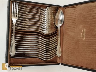 12 plain silver spoons and 12 forks decorated...