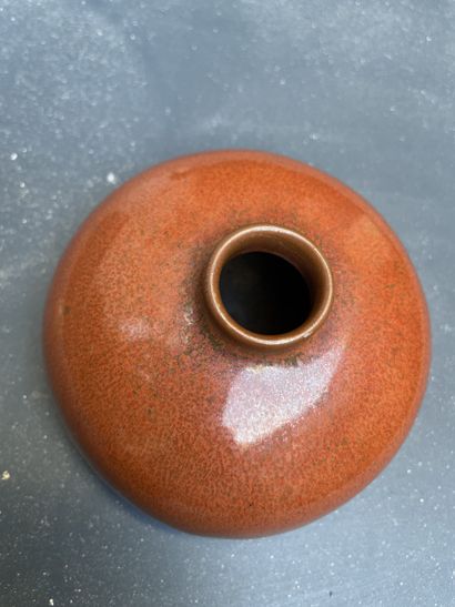 CHINA, 20th century
Red-brown glazed ceramic...