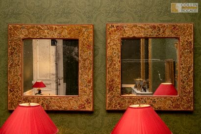 Paire de miroirs dans des encadrements gainés...