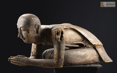 BURMA, 19th–20th century.
A monk kneeling...