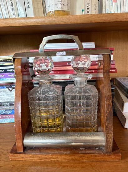 a tray holding two cut-glass bottles