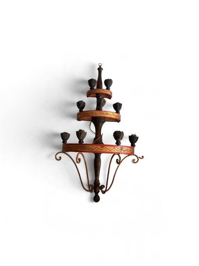 Three-tiered wall sconce with candle holders....