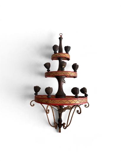 Three-tiered wall sconce with candle holders....