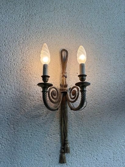 Four two-light wall sconces with ribbon decoration...