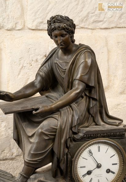 Yellow marble clock, topped with a bronze...