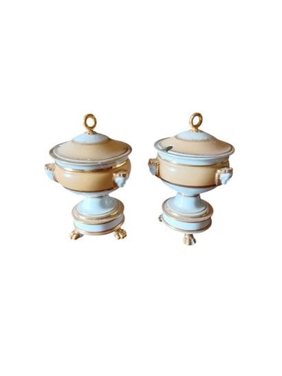 Two porcelain jam jars in shades of salmon....