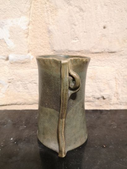 Olive-green ceramic vase with a reserve-decorated...