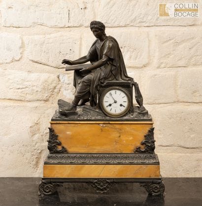 Yellow marble clock, topped with a bronze...