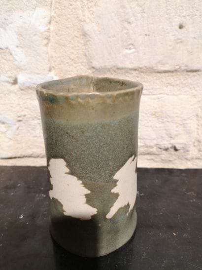 Olive-green ceramic vase with a reserve-decorated...