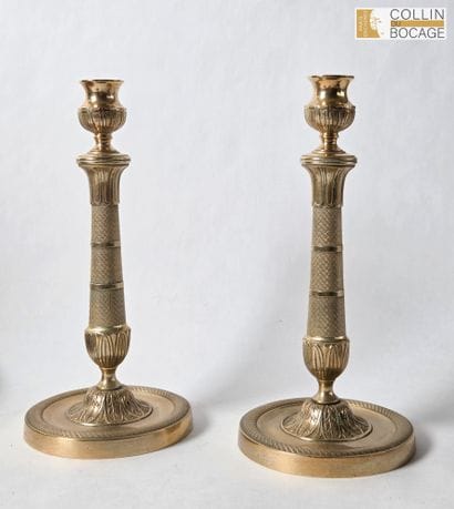 Pair of candlesticks with a guilloché lattice...