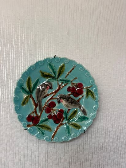 Set of four slurry plates decorated with...