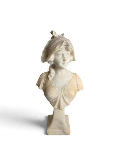Bust of a young girl on a pedestal. Alabaster....