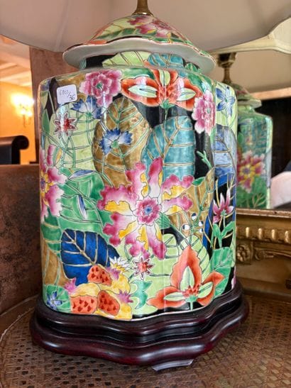 A faceted vase with a floral design and rounded...