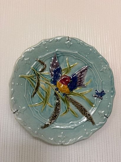Set of four slurry plates decorated with...