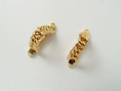 Paire de boutons de manchettes de forme étrier...