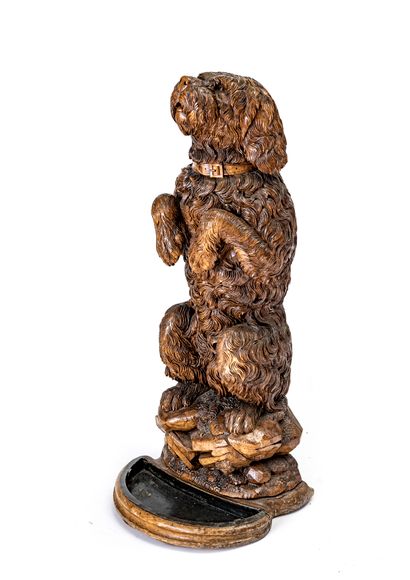 Carved wood rod holder

representing a sitting...