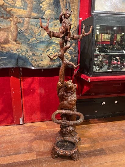 Carved wood coat rack with

decoration of...