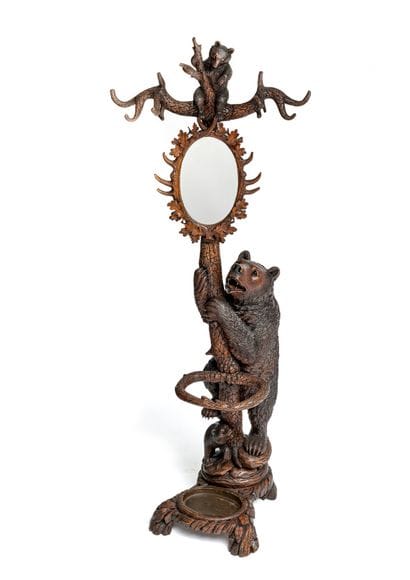 Carved wood coat rack

decorated with a female...