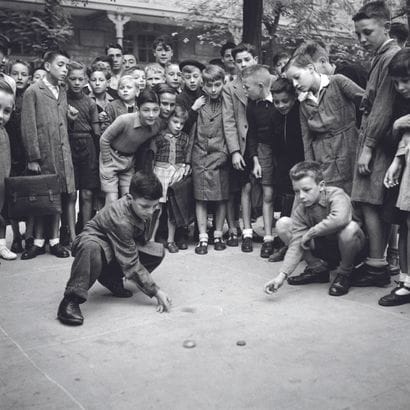 AFP

Schoolboys play marbles in the schoolyard...