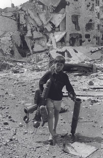 AFP - Nabil ISMAIL

A Palestinian child picks-up...