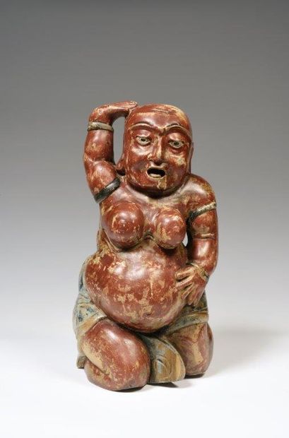
Statuette en bois, représentant une divinité...