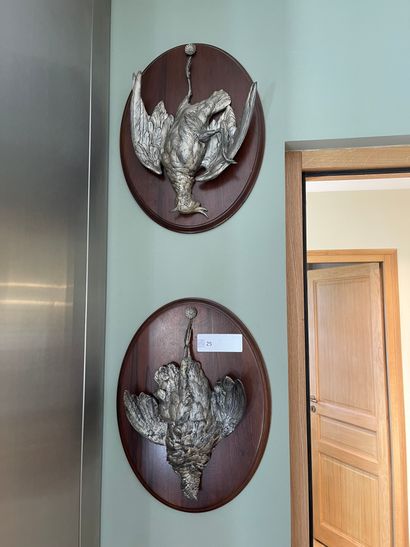 Pair of trophies, low relief in silvered...