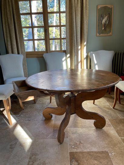 Table guéridon in natural wood resting on...