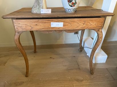 Small natural wood desk opening to a drawer...
