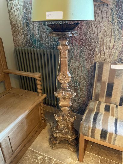 Wooden and stucco floor lamp with an old...